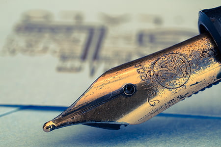 selective photo of fountain pen