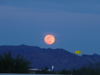 total lunar eclipse over mountain range