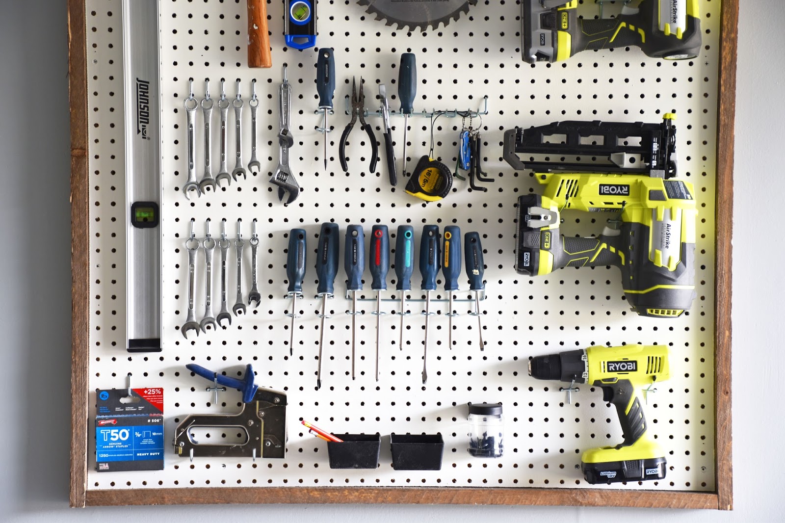 Woman in Real Life Garage Organization DIY Pegboard Tool Organizer