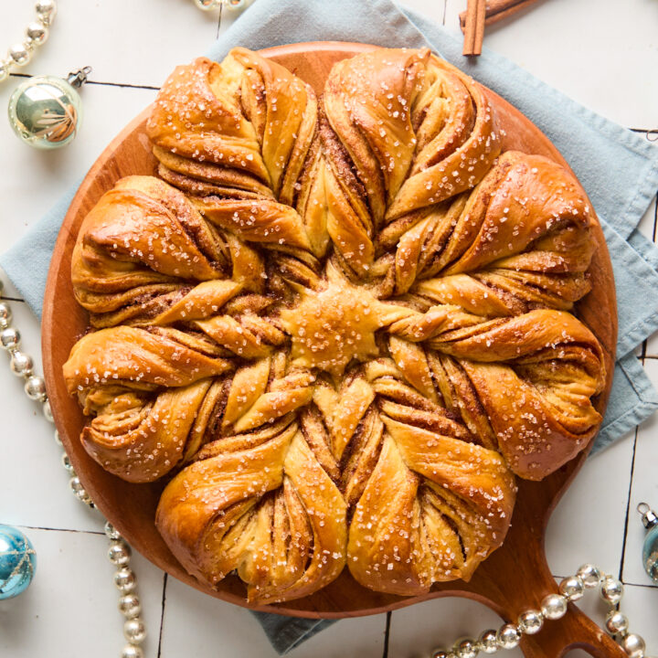 baked snowflake bread on a wooden board