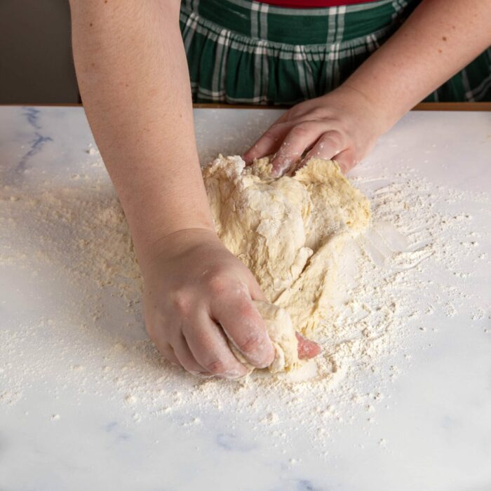 stretching dough by hand