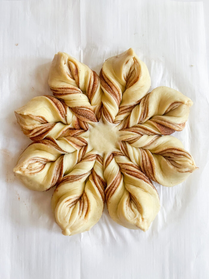 raw unbaked snowflake bread after shaping