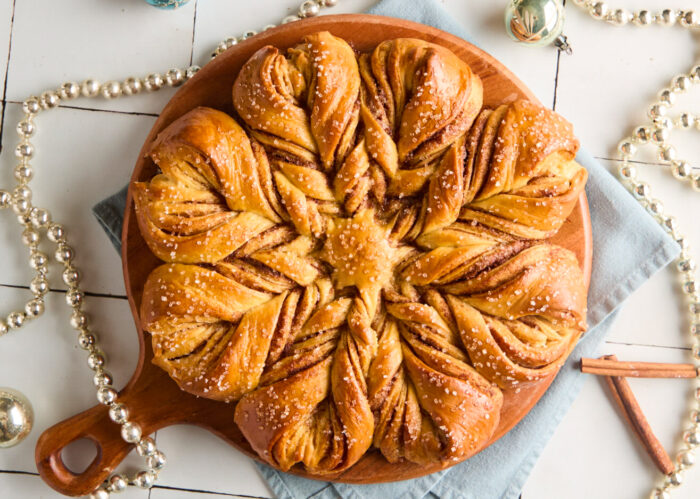 baked snowflake bread on a wooden board