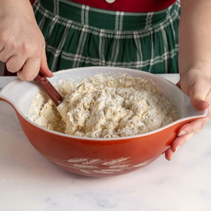 mixing the dough in a large bowl with a spatula