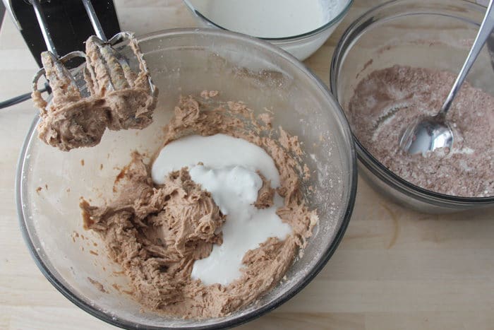 Adding a small amount of the wet ingredients into the bowl