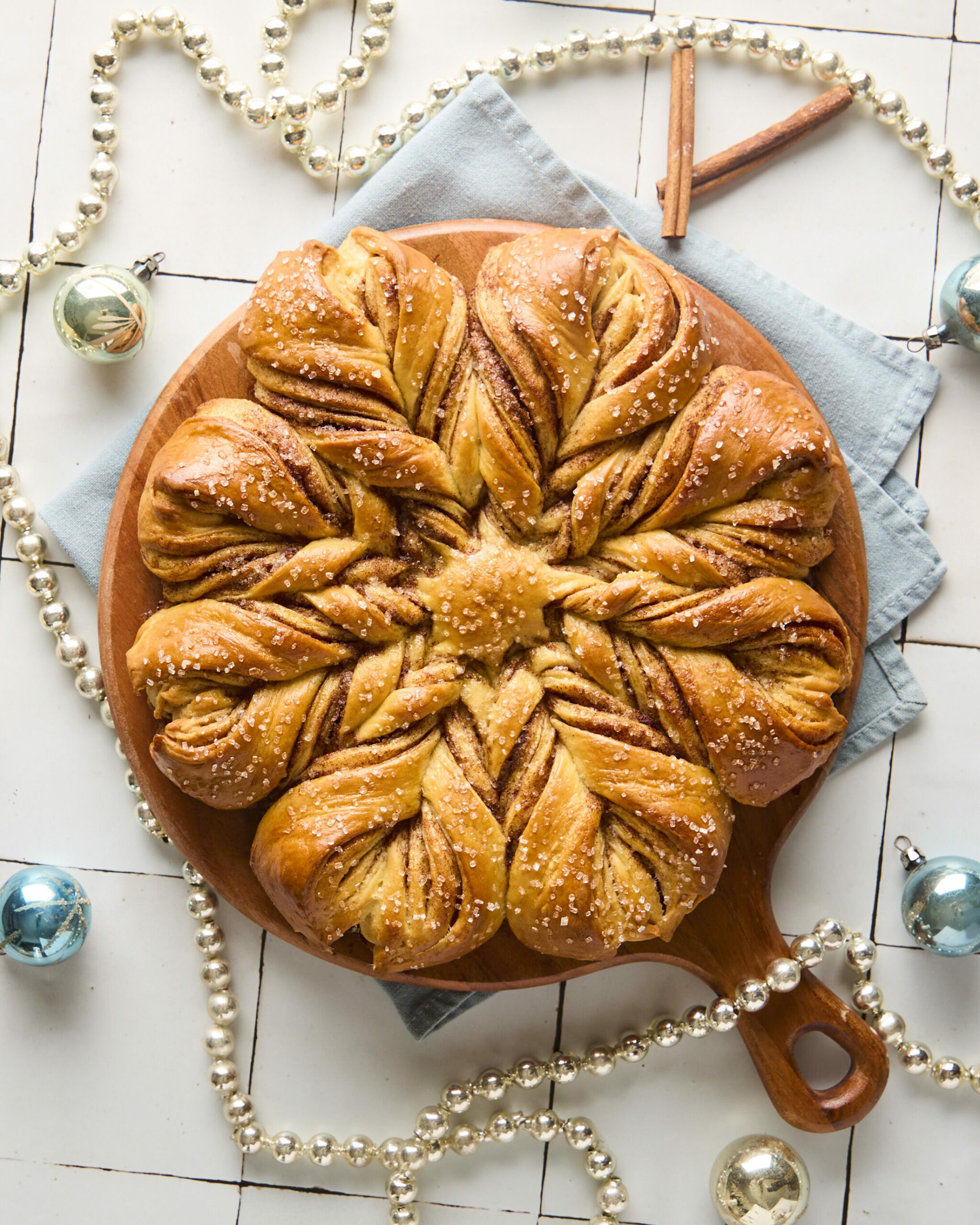 baked snowflake bread on a wooden board