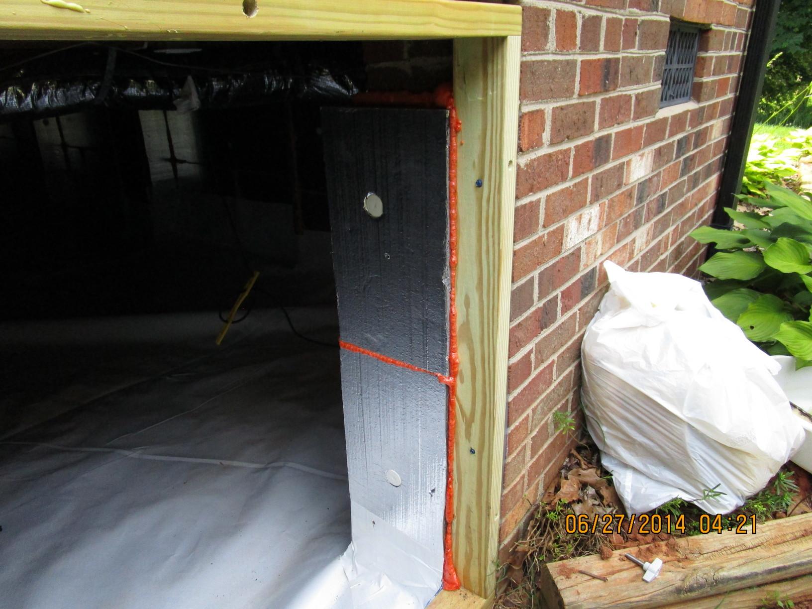 Crawl space encapsulation crawl space door