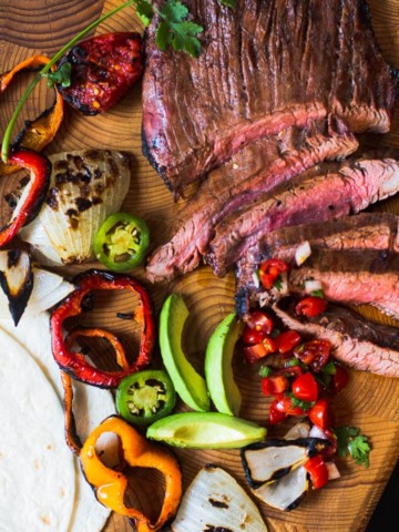 Flank Steak Fajitas with grilled vegetables, avocados and flour tortillas