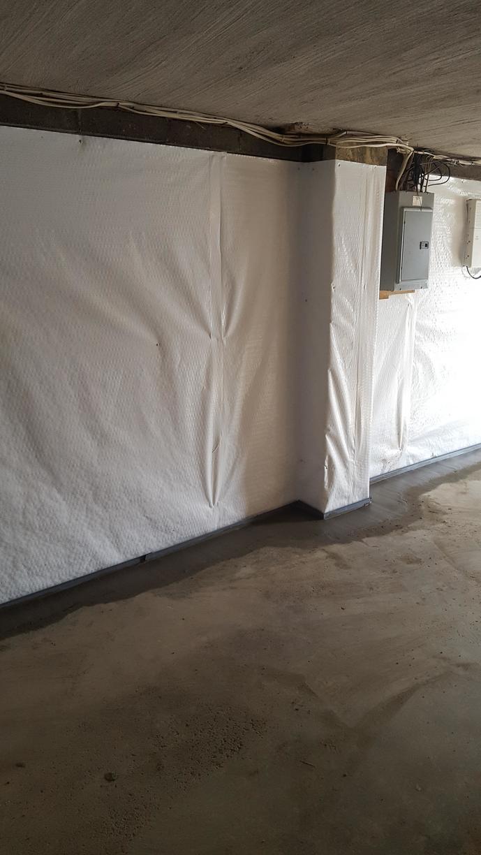 Can I install rigid foam board over vapor barrier that is