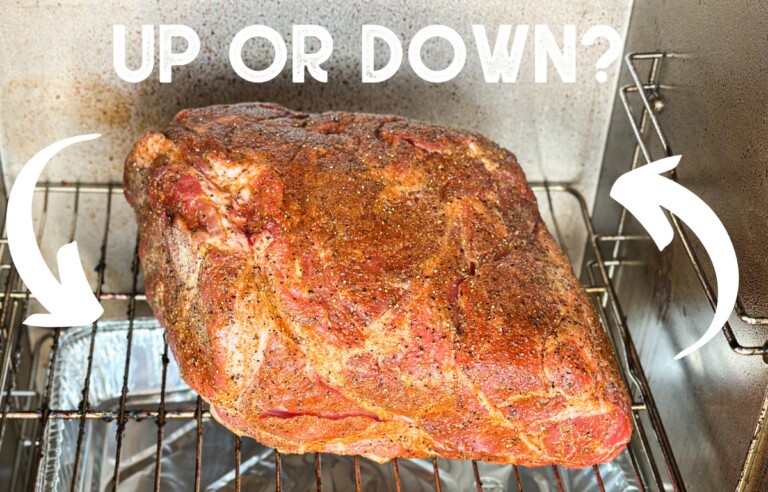 pork butt on electric smoker with text "up or down?"