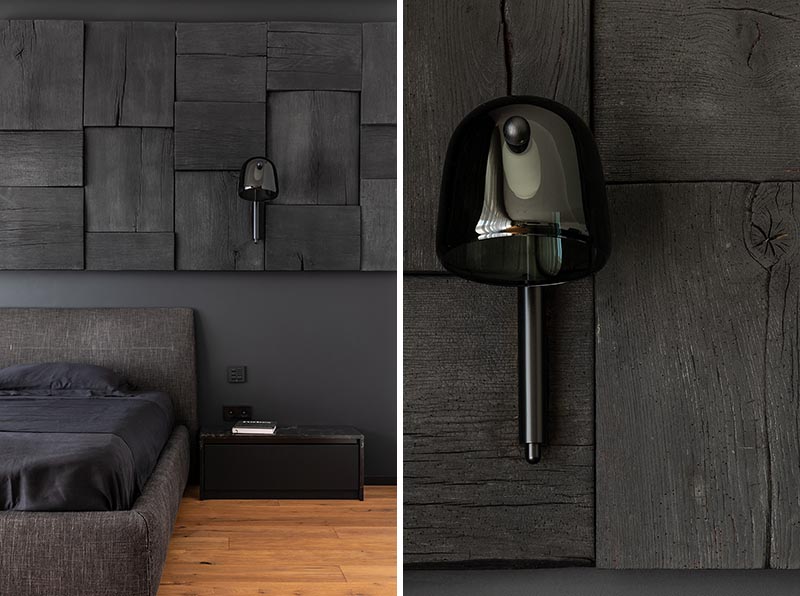 A Blackened Wood Accent Wall Provides Some Creative Texture In This Bedroom