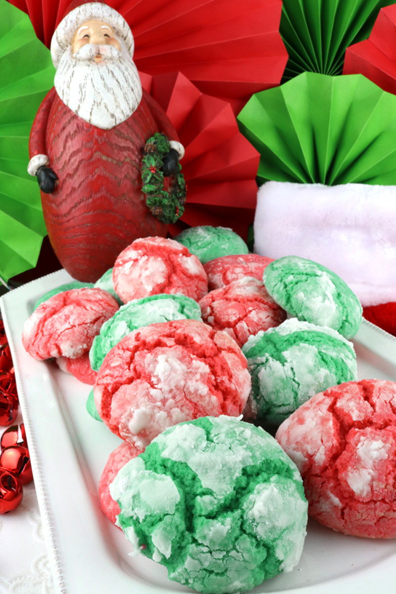 Kris Kringle Crinkles are light and fluffy on the inside and sweet and crunchy on the outside. A yummy homemade Crinkle cookie recipe that is not made from cake mix.