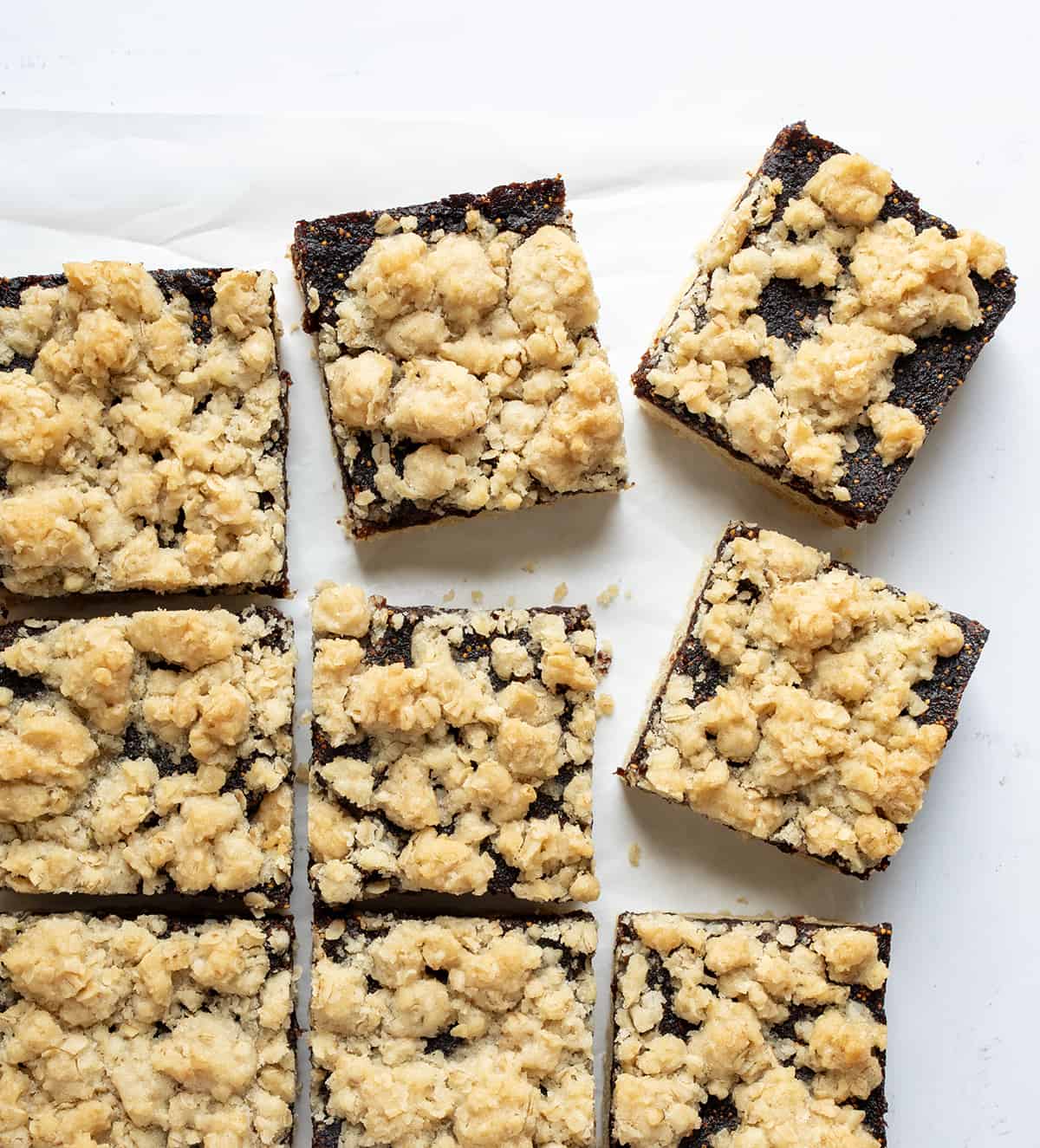 Fig Bars Cut Into Squares and Separated on a White Counter from Overhead.