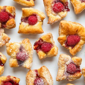 Raspberry Cream Cheese Bites on a white table shot from overhead.