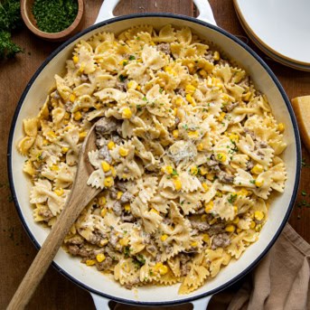 Skillet of Creamy Ranch Beef Pasta on a wooden table from overhead.