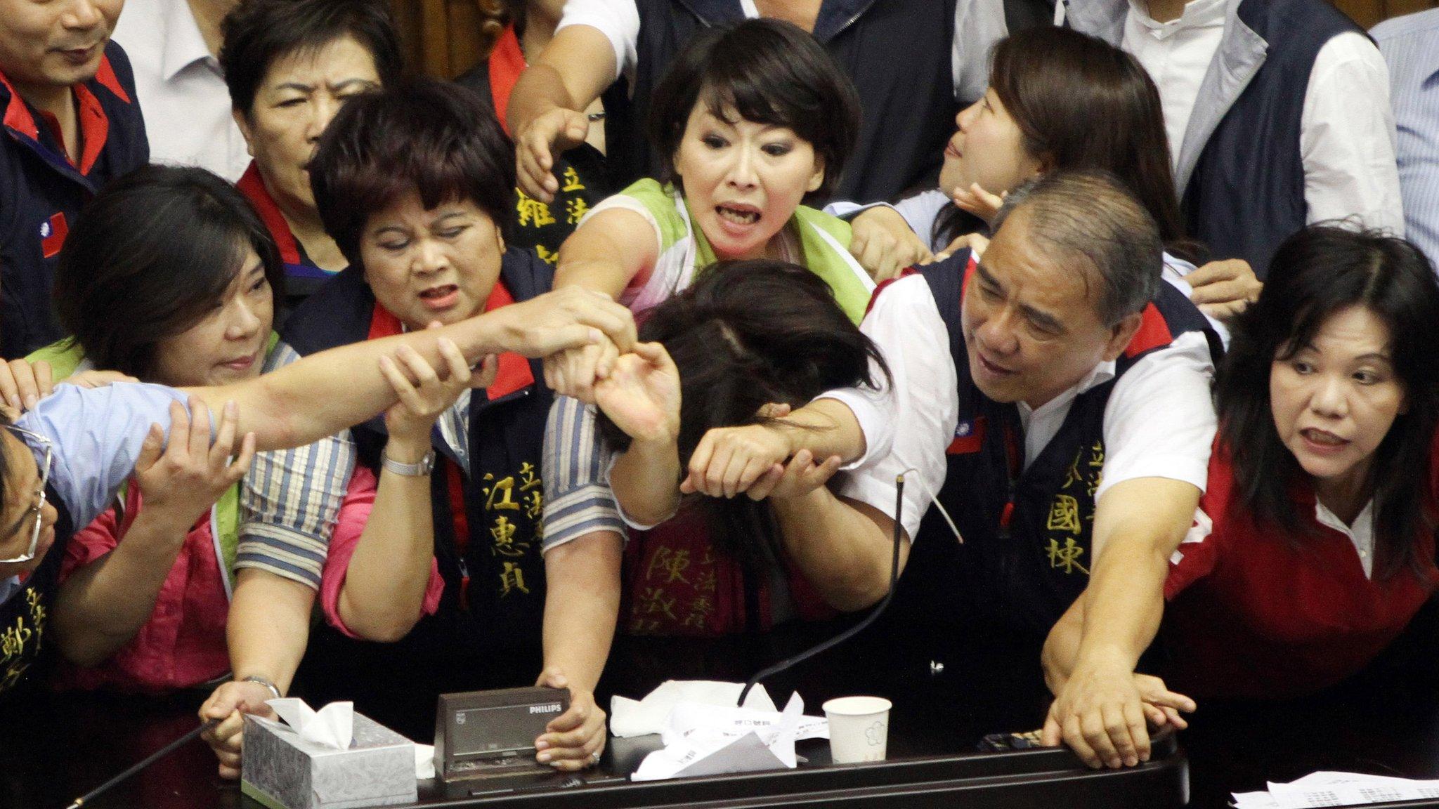 A scuffle breaks out between legislators in Taiwan's parliament in 2013.