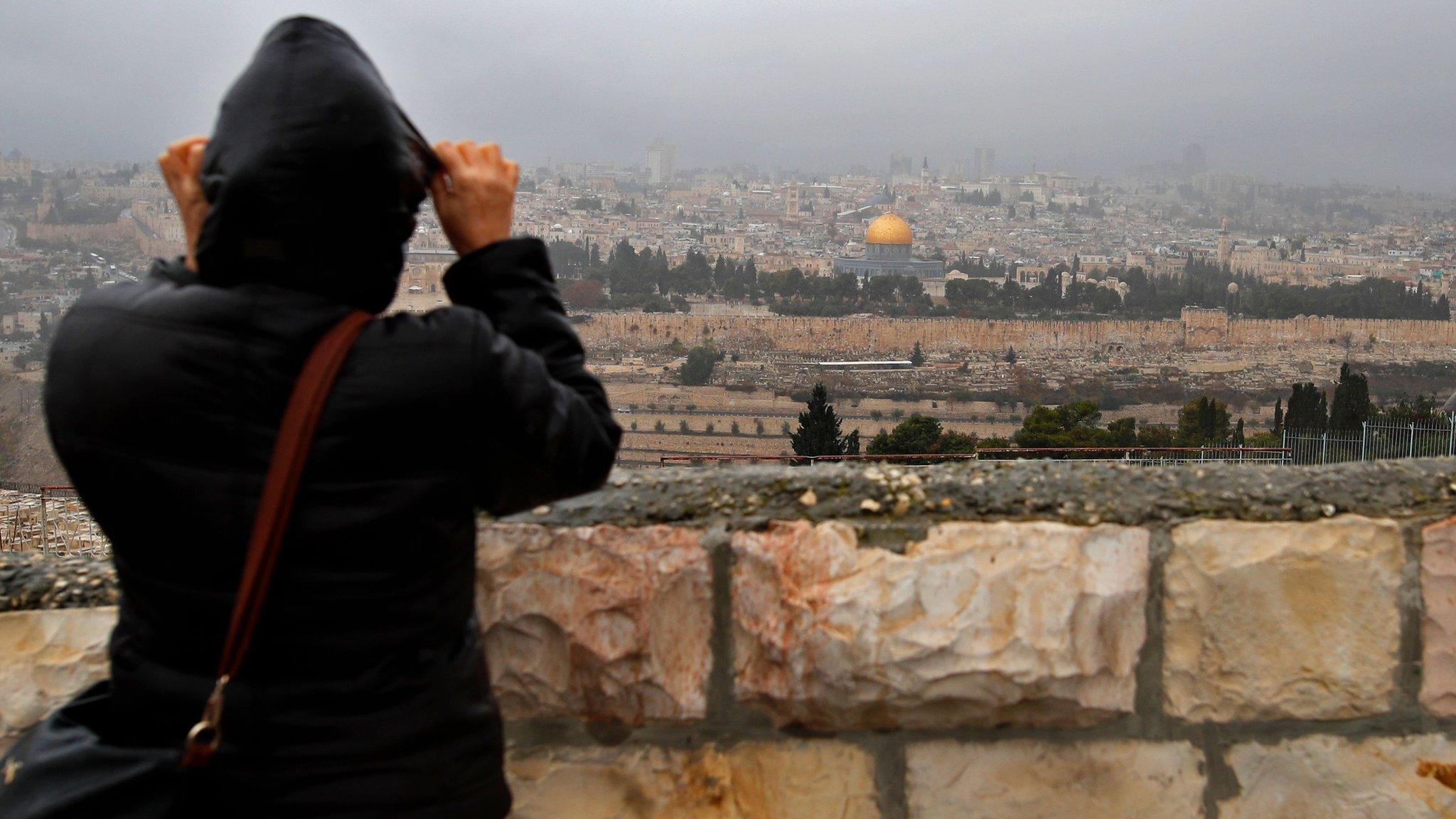 Person looks over at the Old City of Jerusalem on 6 December 2017