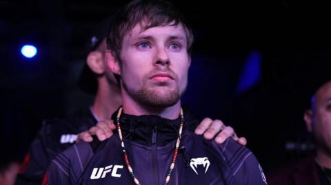 Bryce Mitchell walks out towards the Octagon prior to facing Ilia Topuria