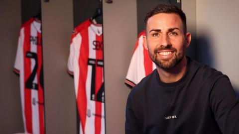 Narcis Pelach in the home dressing room at Stoke