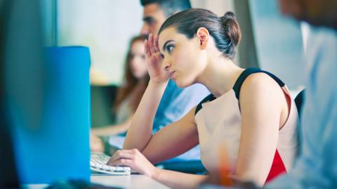 Female worker looking stressed