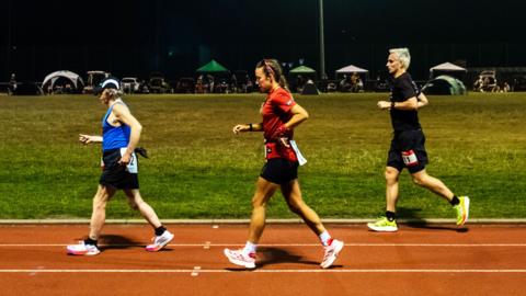 Runners compete in the Sri Chinmoy 24hr Track Race in Battersea Park