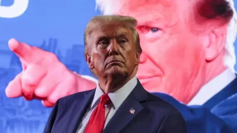 Donald Trump attends his campaign rally at Van Andel Arena in Grand Rapids, Michigan, U.S., November 5