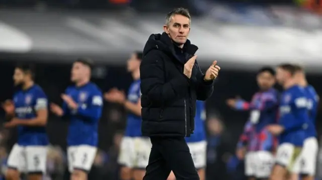 Kieran McKenna, Manager of Ipswich Town, applauds the fans
