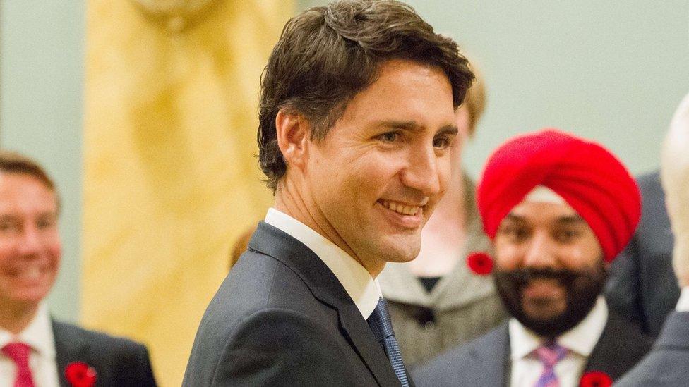 Prime Minister Justin Trudeau arrives for a photo with his newly sworn in cabinet after a ceremony at Rideau Hall in Ottawa, Ontario, November 4, 2015.