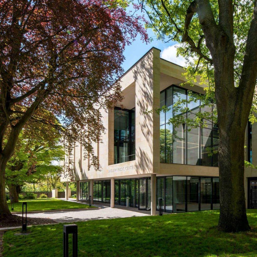 The Laidlaw Music Centre surrounded by mature trees in St Andrews.