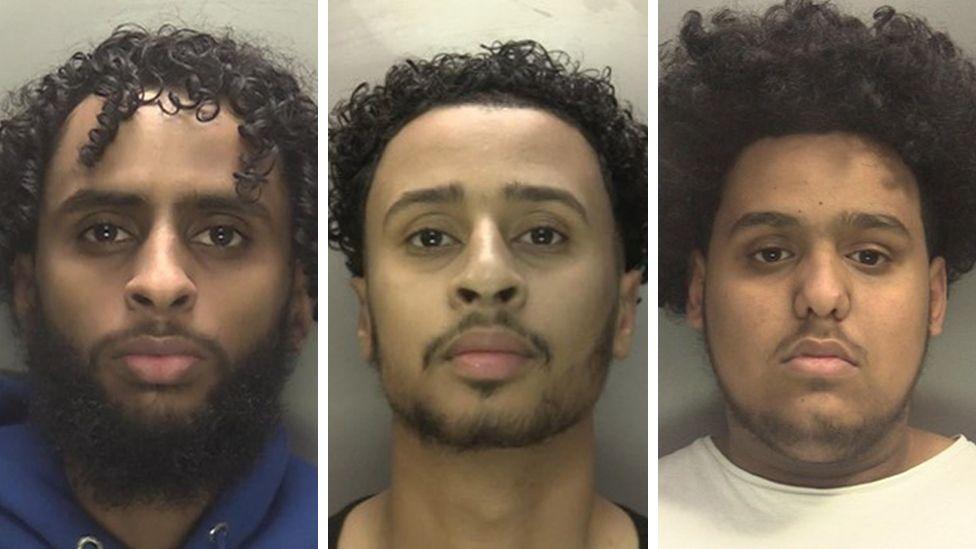 Wasim Omar, Mohammed Sharif and Ali Hassan appear in police mugshots. Wasim has dark curly hair and a beard and is wearing a blue top. Mohammed has dark hair and a beard and Ali also has dark hair and a slight beard. 