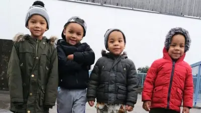 Kyson and Bryson Hoath, aged four (left), and Leyton and Logan Hoath, aged three (right).  All of dem dey smile for di camera, dem wear puffer jackets wit hats on.