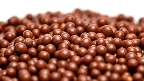 Pile of small round chocolates (Credit: Getty Images)