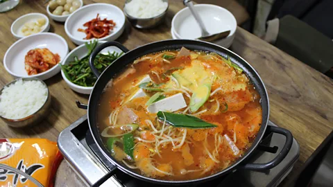 Hahna Yoon Today, budae-jjigae is found all over South Korea, with many restaurants specialising in the dish and families frequently making it at home (Credit: Hahna Yoon)