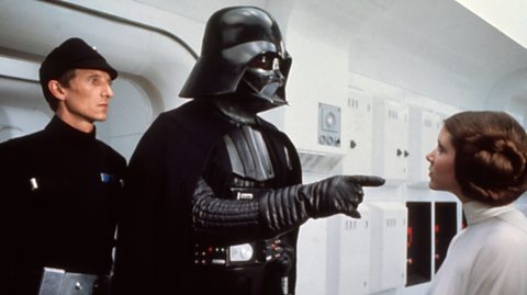 Darth Vader and Princess Leia during a scene from Star Wars