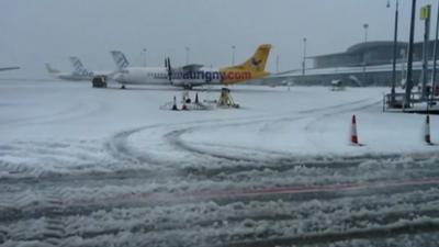 Planes at snow-covered airport