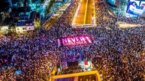 Reuters An aerial view shows people protesting at the Israeli's government's judicial overhaul in Tel Aviv, Israel (18 March 2023)