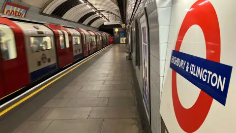 Tube arrives at Highbury and Islington station 