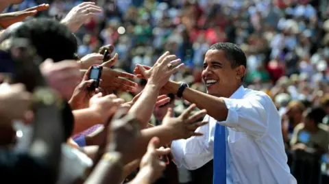 Barack Obama greets voters at a rally during 2008 presidential campaign