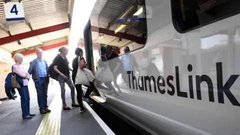 EPA People boarding a Thameslink train 