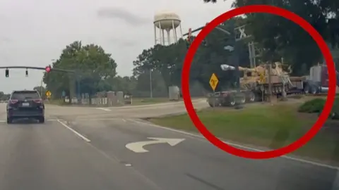 A circle around the vehicle moments before a freight train crashes into it