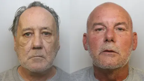 Side-by-side custody images of Martin Carty (left) and Mark Sothcott. Carty has thinning grey hair, swept back from his face, and light grey short facial hair. He has deep bags under his eyes and a downturned mouth. Sothcott is bald with light grey facial hair, and has an eyebrow piercing in his right eyebrow and another piercing in his right ear. 