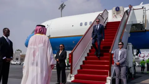 The US secretary of state, Antony Blinken exits a plane and walks down stairs as he arrives in Doha on a recent visit to Qatar