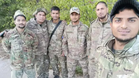 A group of discharged men near the Russia-Ukraine border on their way out