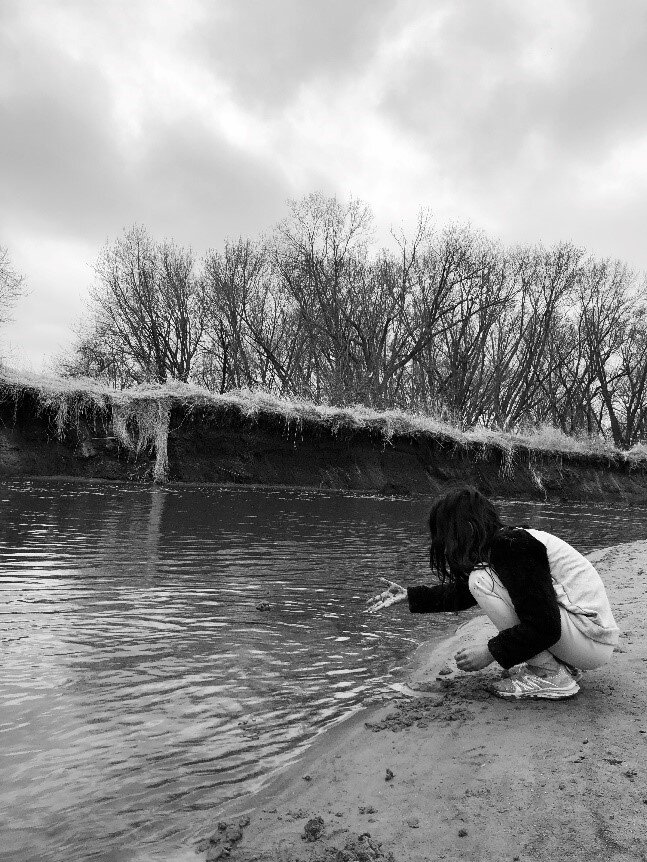 Girl by water