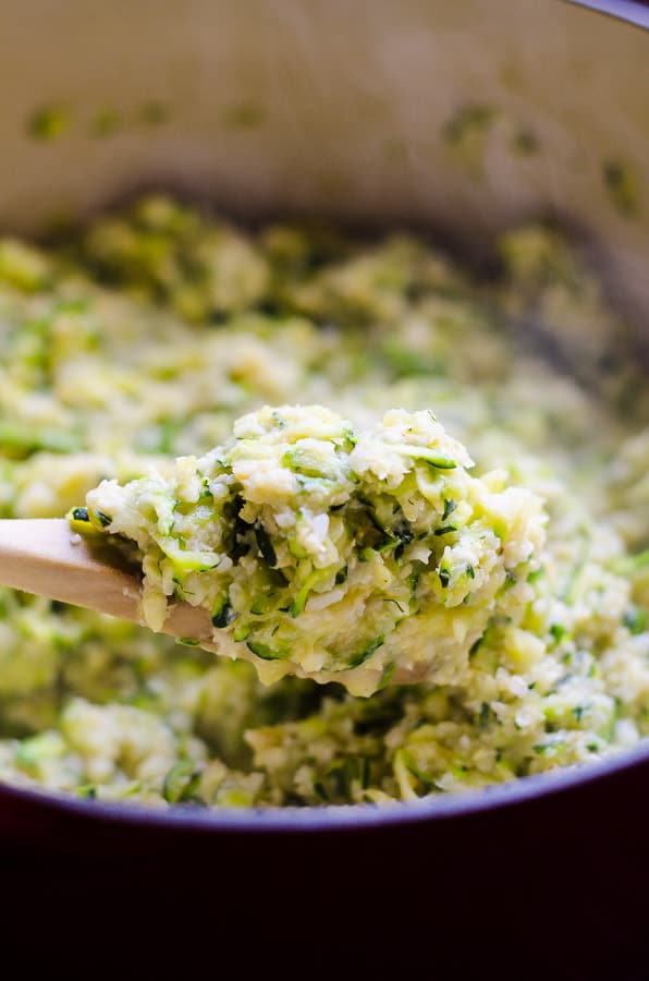 Cheesy Cauliflower Rice and Zucchini on wooden spoon