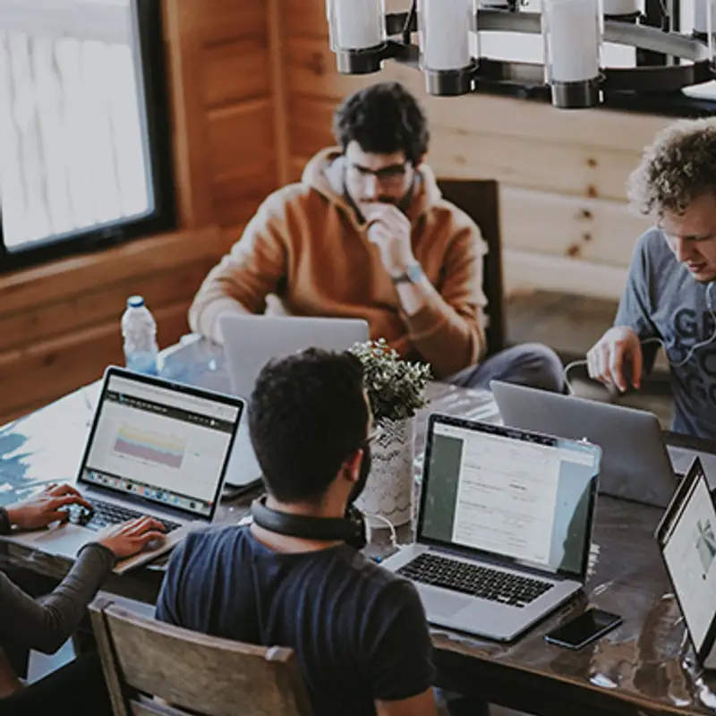 Five people using laptops