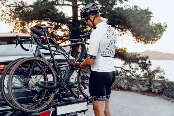 Man loading a SUV bike rack