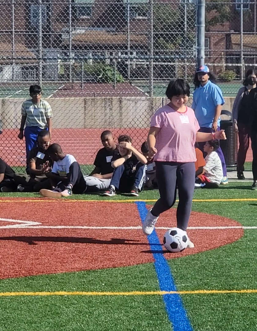 Student Placing Soccer