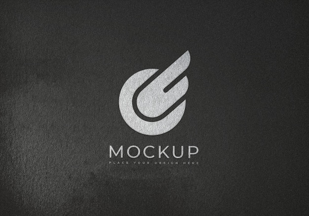 Premium PSD | White logo mockup on texture surface