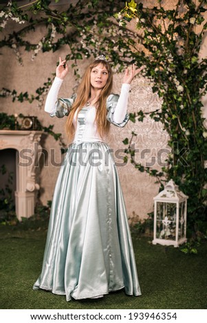 Photo of romantic woman in fairy garden